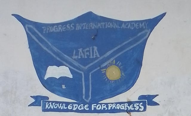 Progress International Group of Schools official crest — blue shield with book and sun symbols